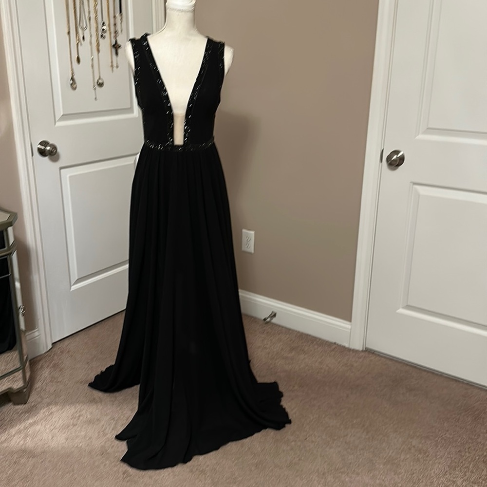 A long evening gown with black beading